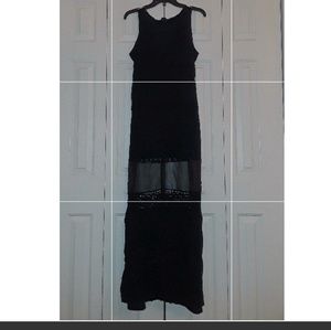 A cute black button up dress with mesh detail